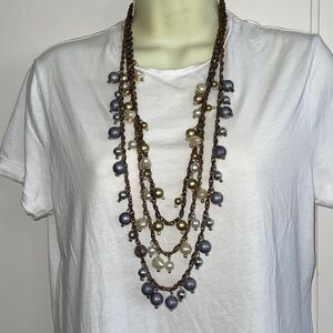 Three strand long necklace with large cream, silver & gold‎ pearlized beads